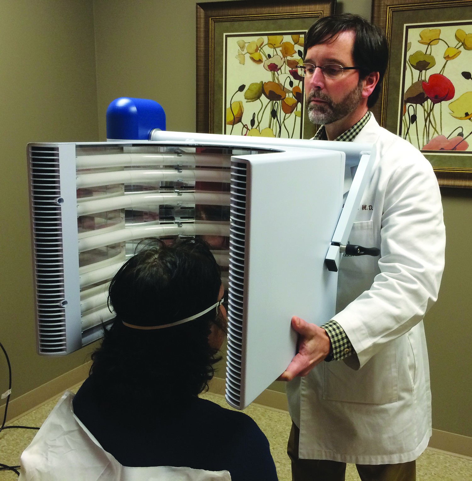 Dr. Patrick Teer uses photodynamic therapy to treat precancerous skin spots.